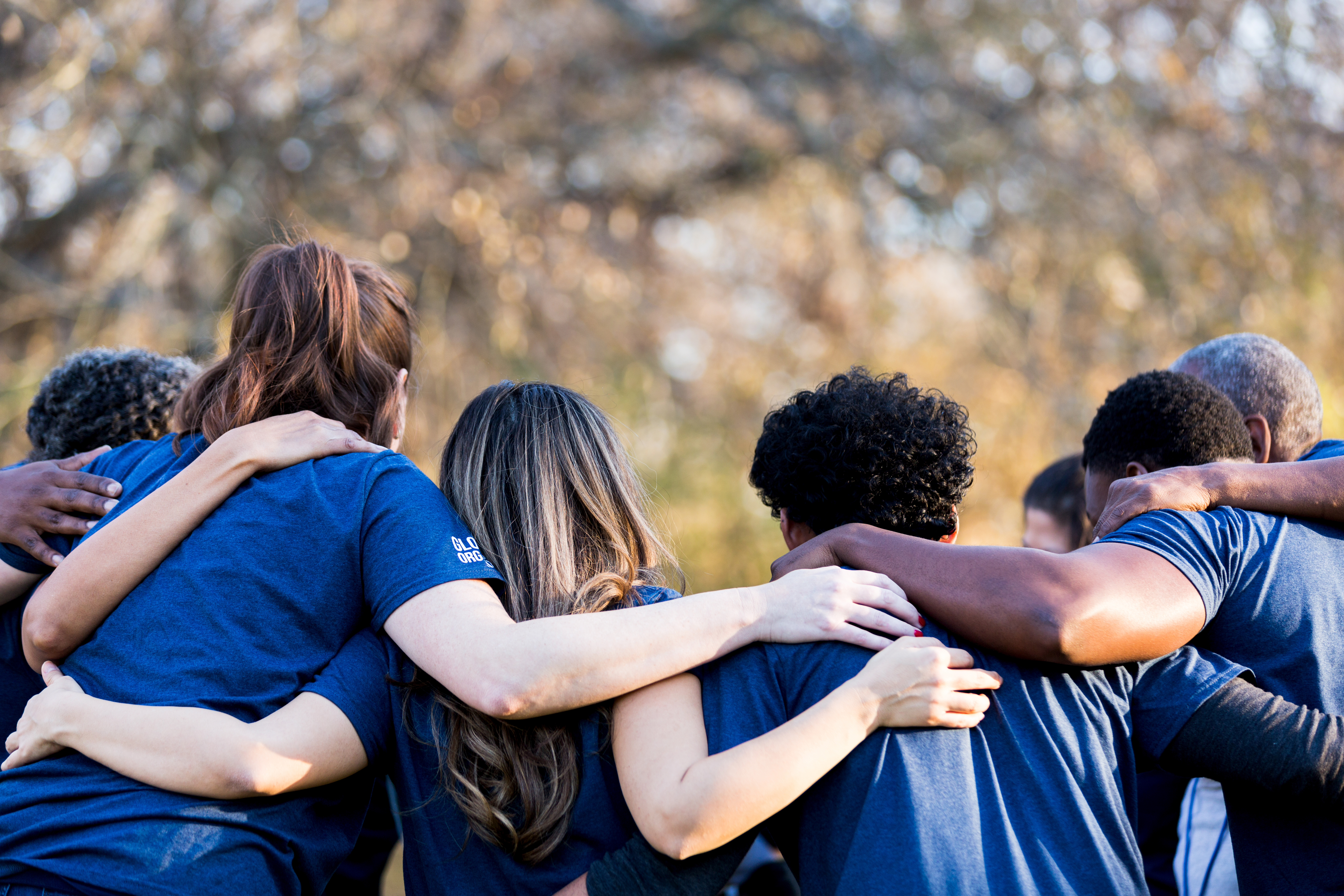 community coming together in a huddle