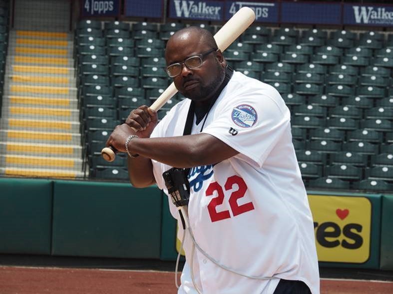 man on baseball field with bat