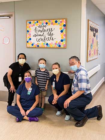 Caregivers with patient at the NICU