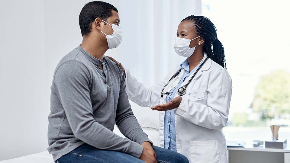 Urgent care doctor with patient.