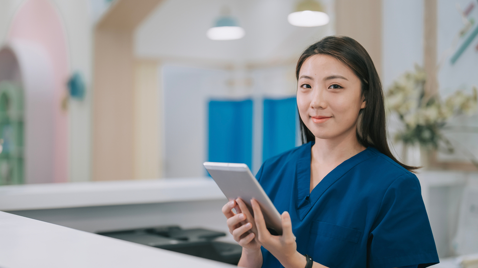 Nurse at hospital registration desk