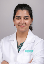 Headshot of Mahin Janjua with a gray background