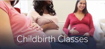 Three pregnant women each holding their belly in birthing class