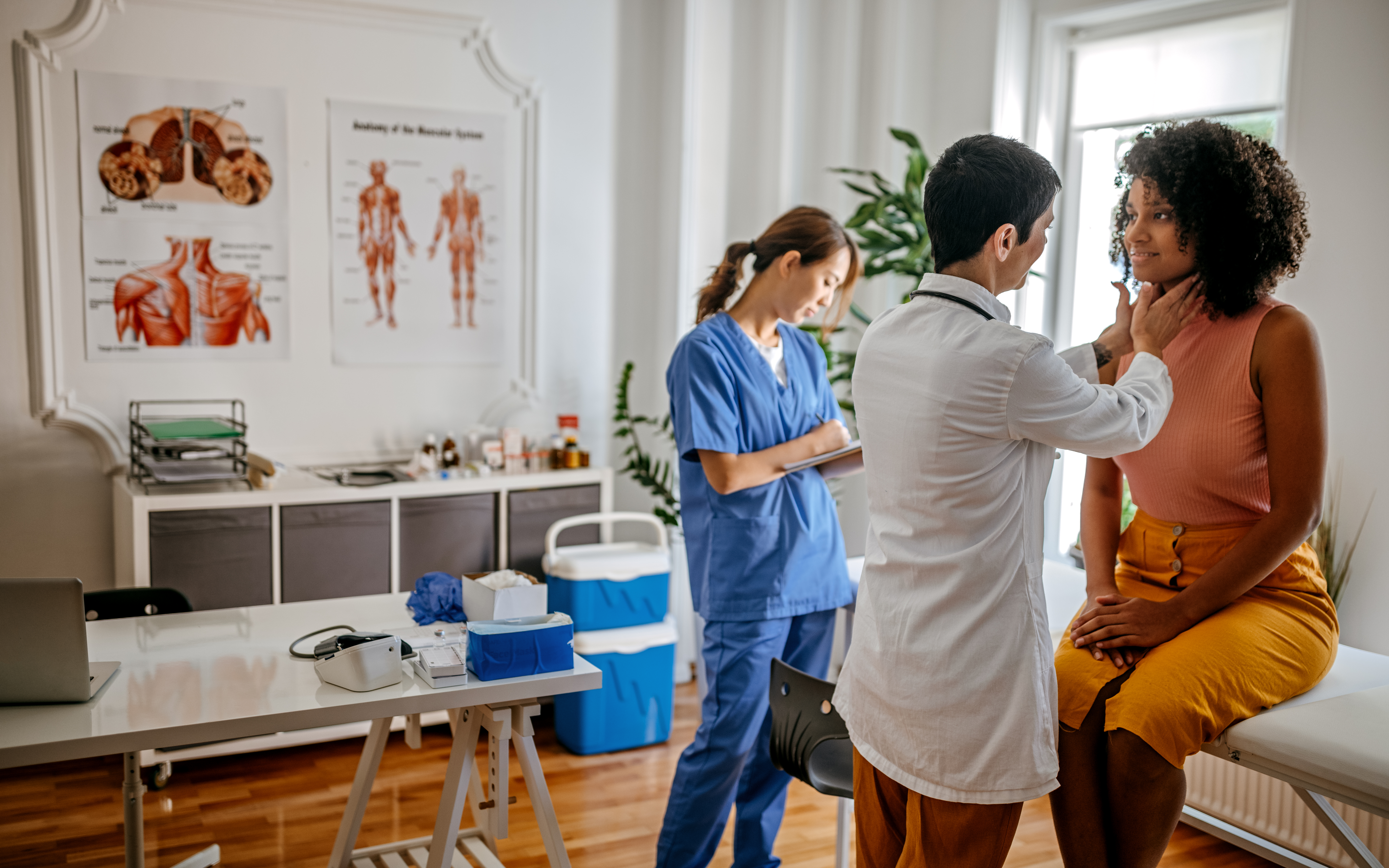 A patient getting an exam by a doctor.