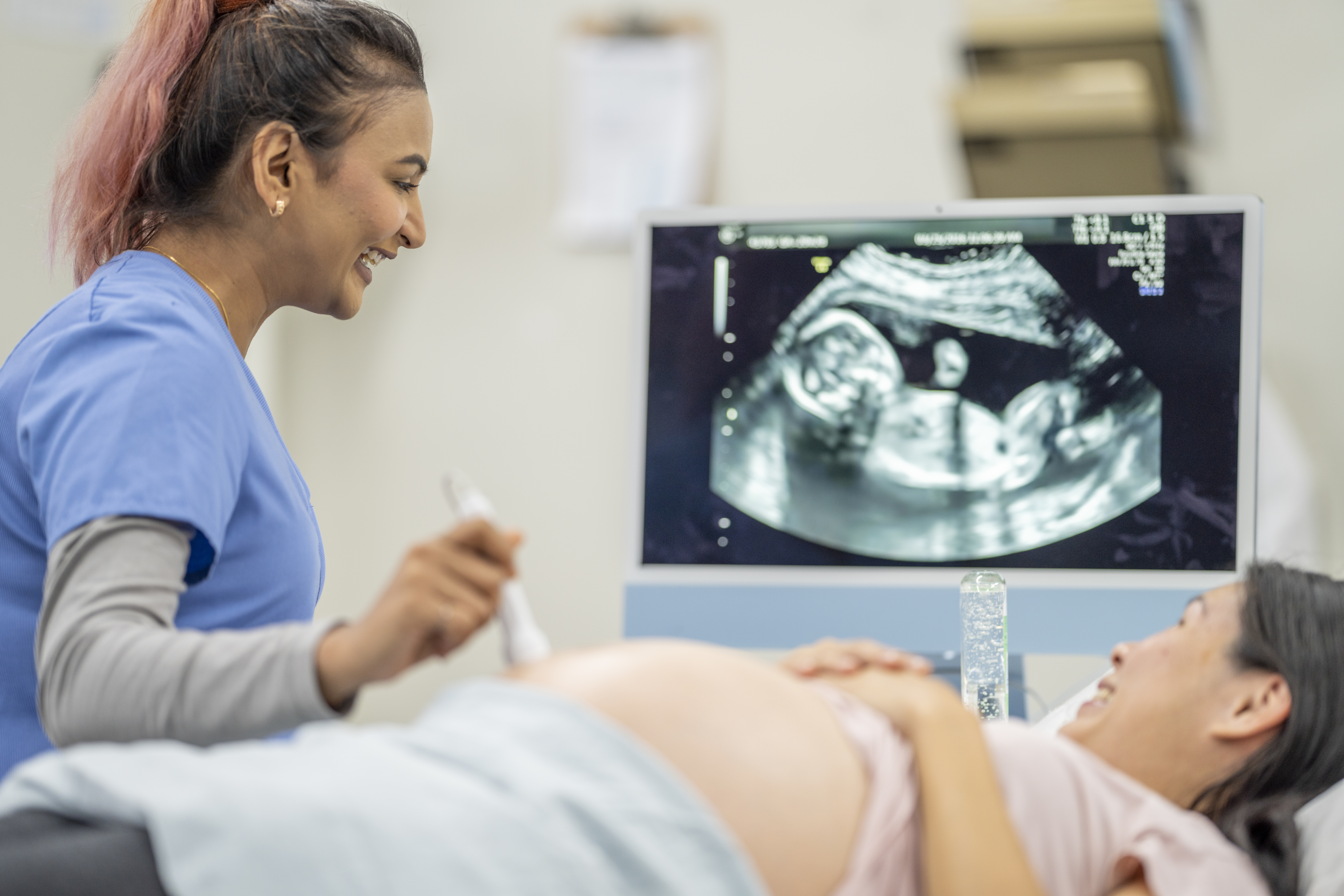 Woman receiving ultrasound services