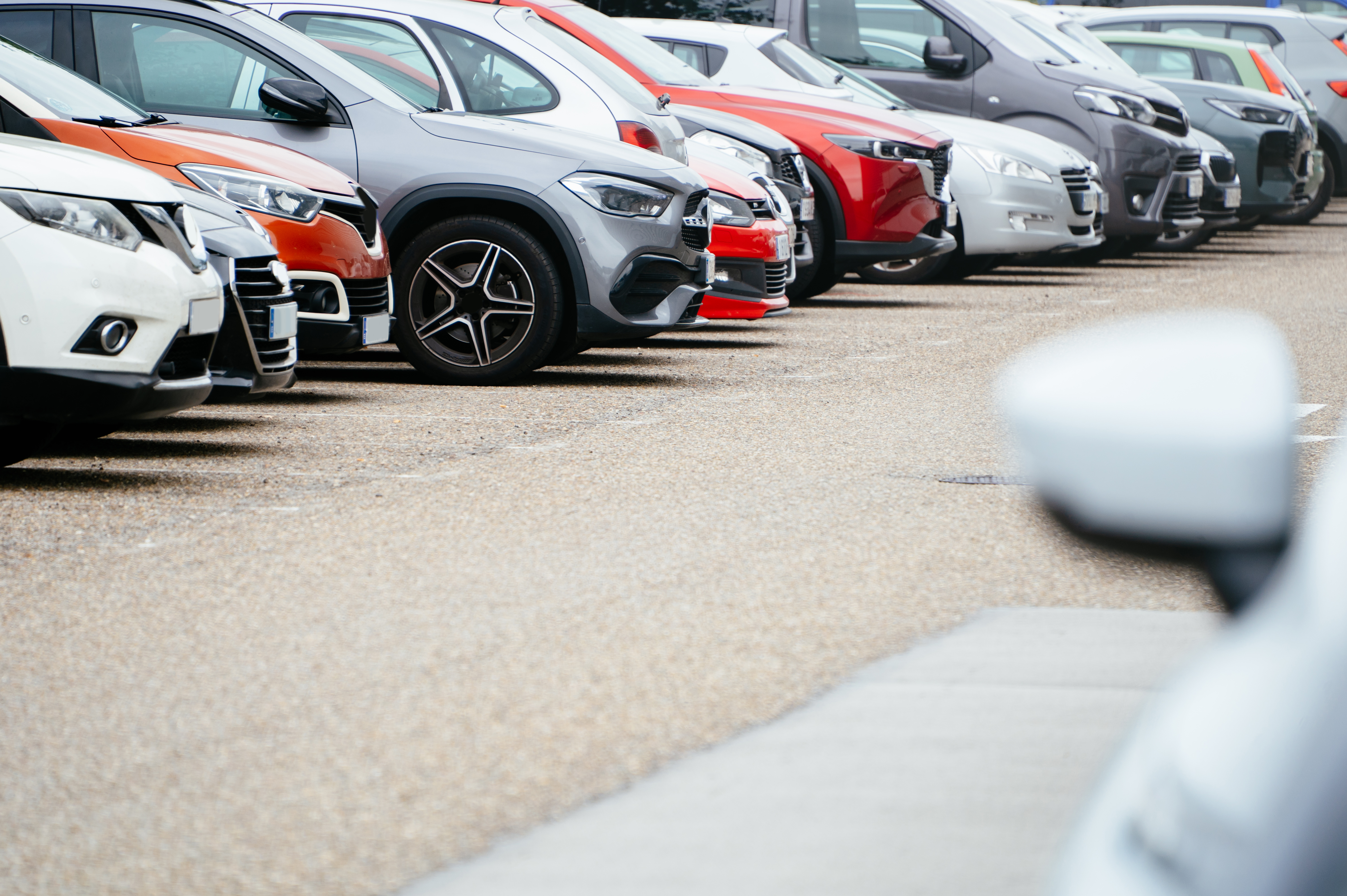 Picture of cars lined up in a parking lot