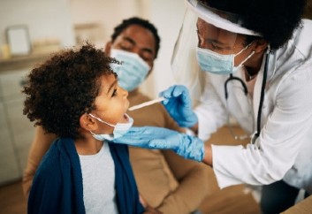 Doctor examining child
