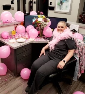 Sandy surrounded by pink balloons