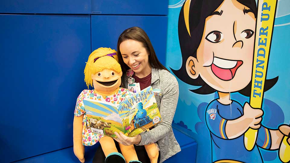 Reading to a child as part of the Dolly Parton Imagination Library
