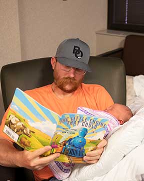 Reading to a child as part of the Dolly Parton Imagination Library