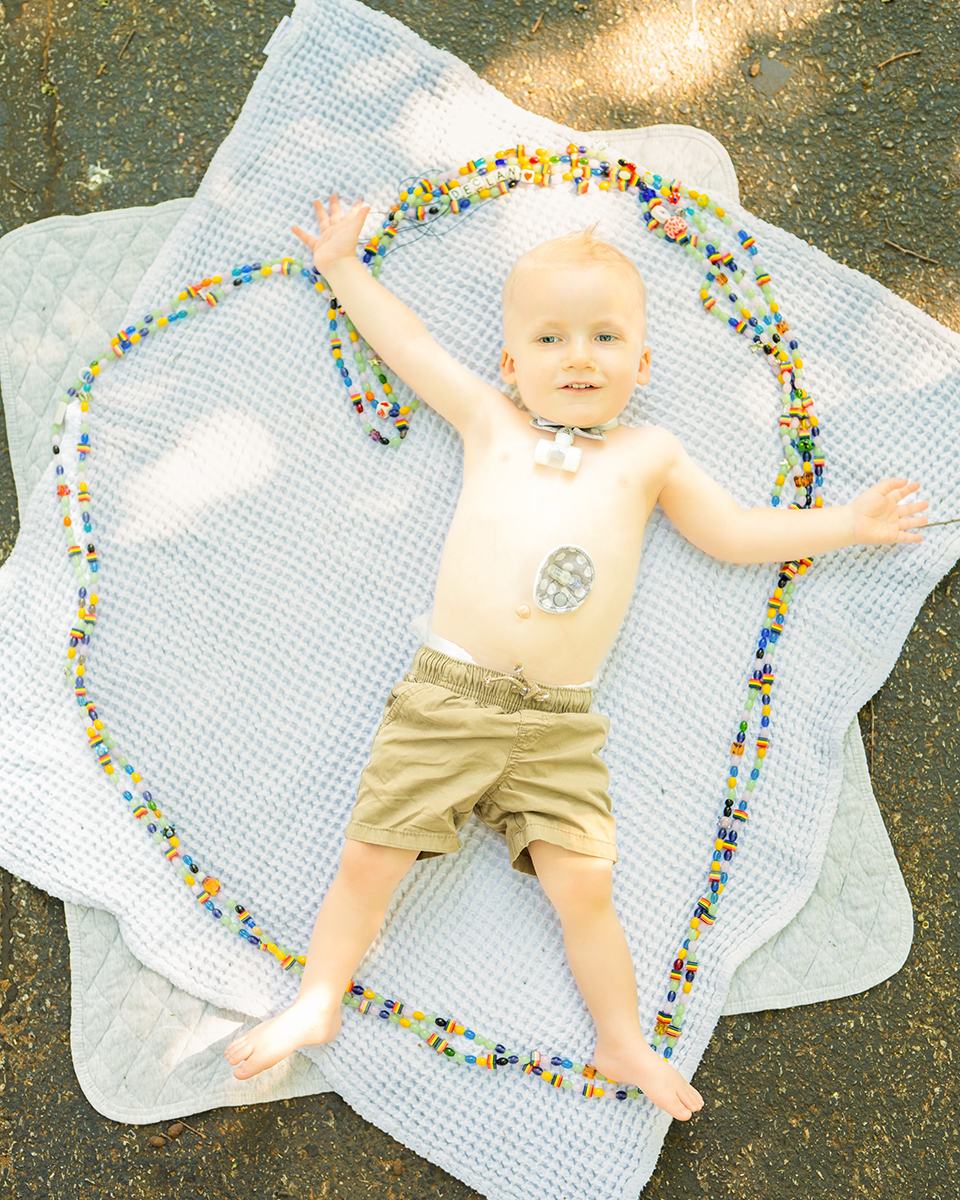 Declan surrounded by his beads of courage.
