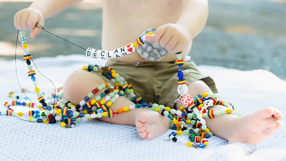 Declan holding up his beads of courage.