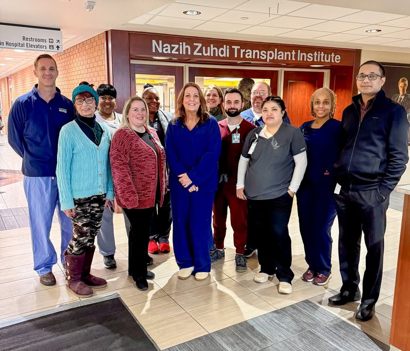 Jill Castleberry and transplant team. Jill is in all blue in the middle of the photo.