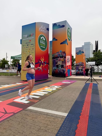 Ashley crossing the finish line