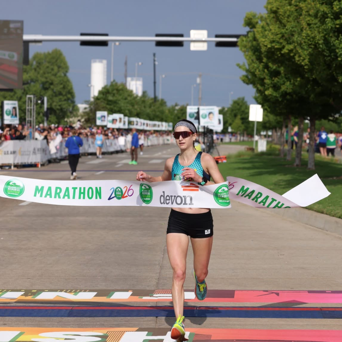 Maddie crossing the finish line