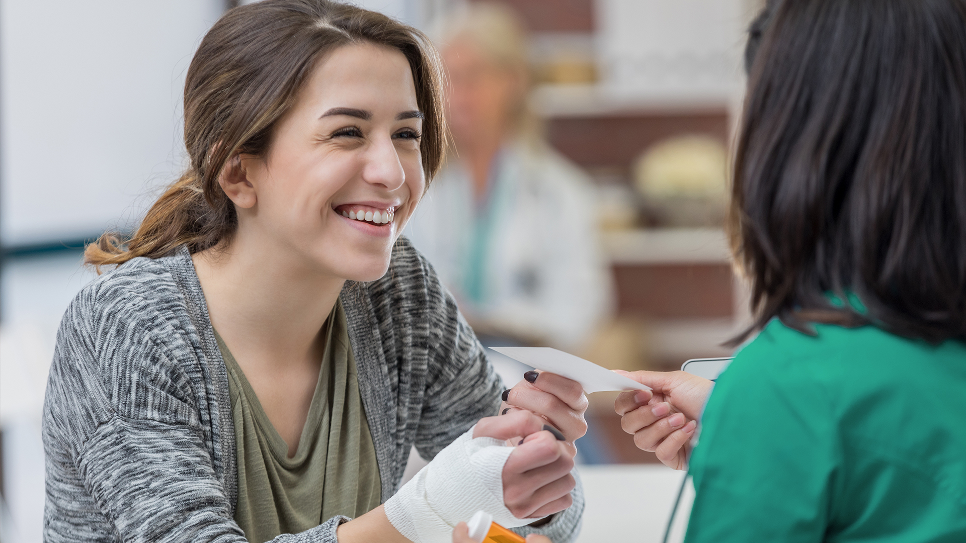 Woman with broken wrist visiting an urgent care clinic
