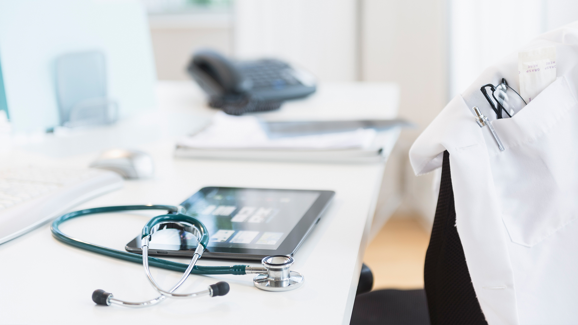 doctor's desk with medical equipment