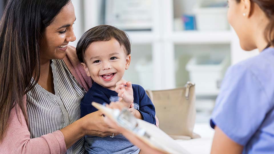 Doctor with mom and baby