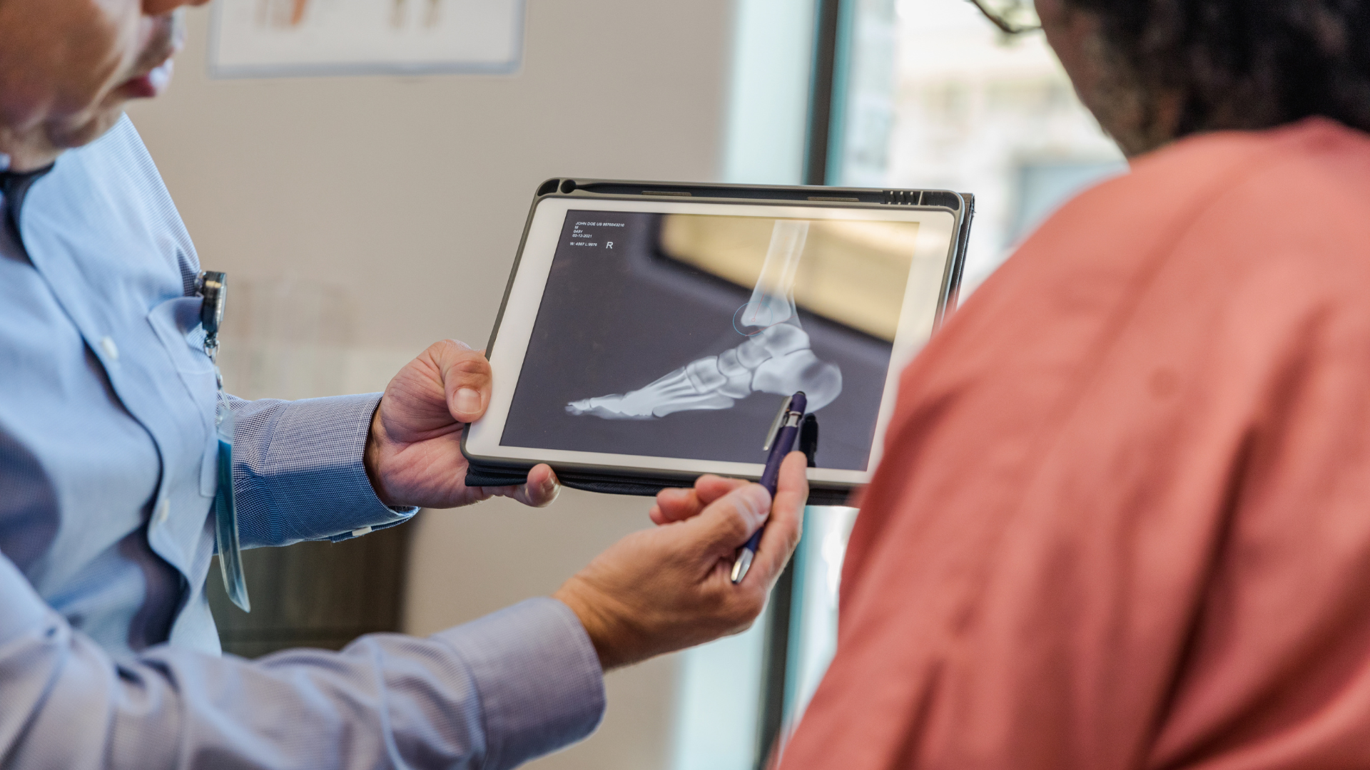 Doctor showing patient x-rays
