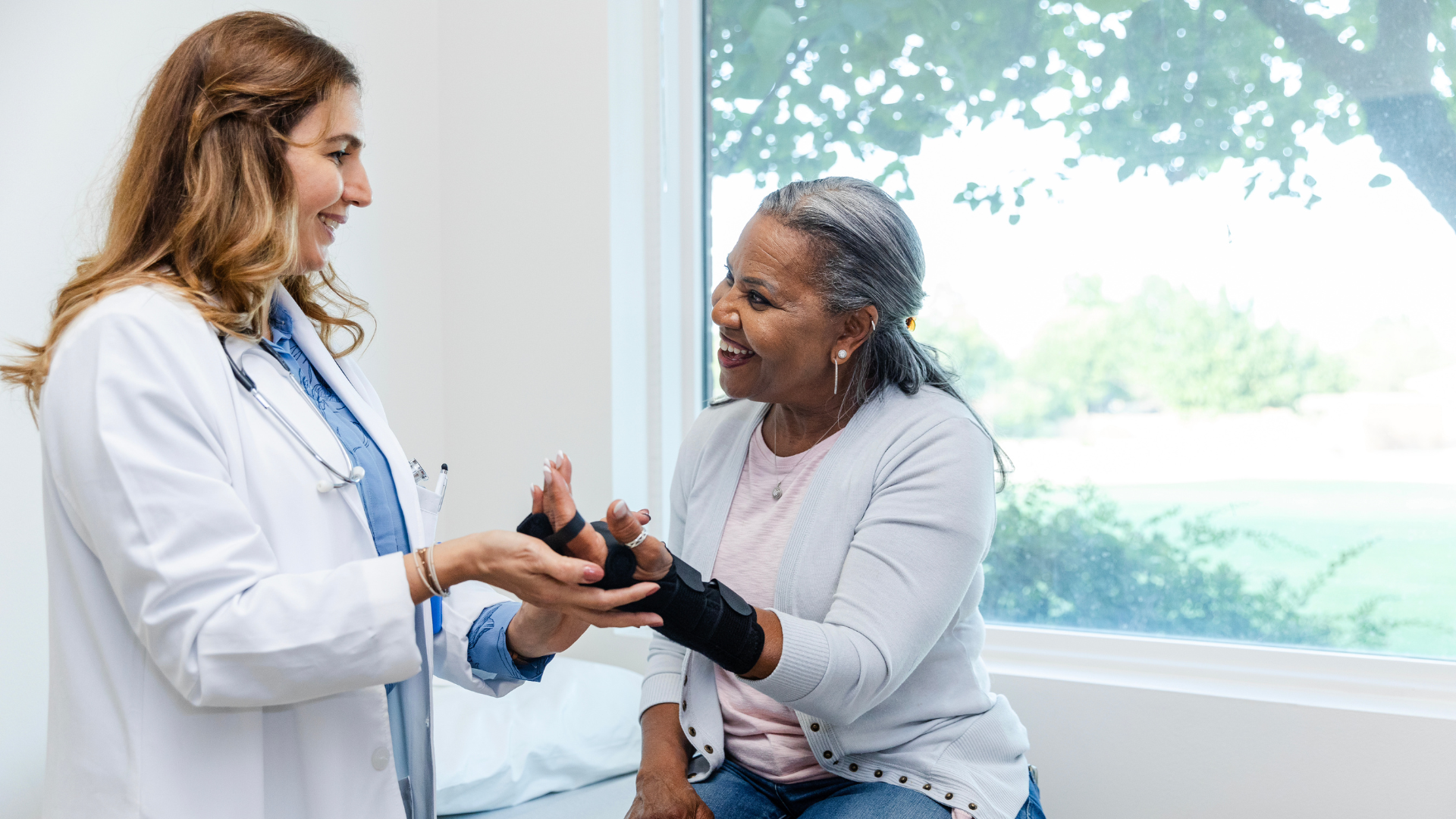 Doctor checking on patients wrist
