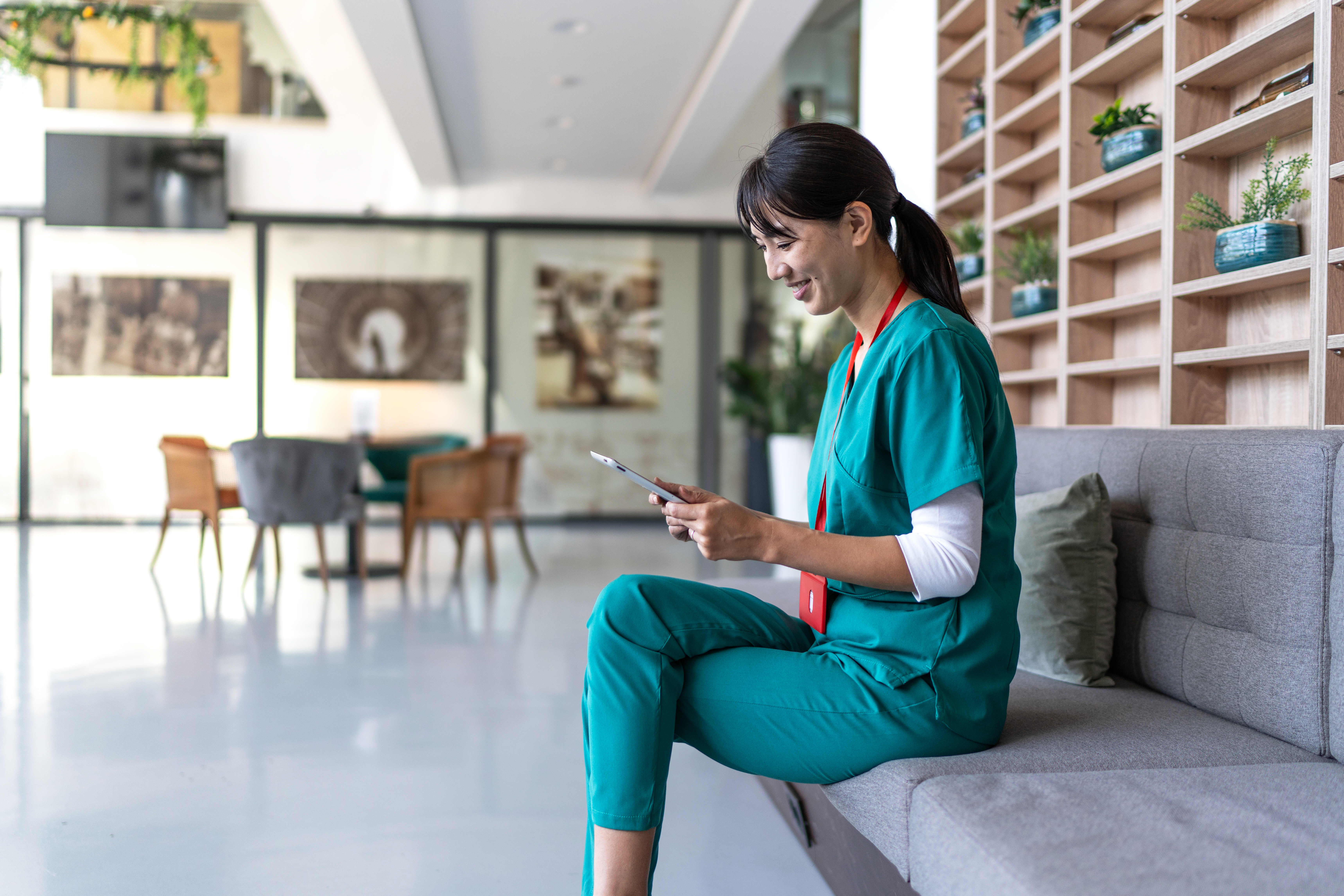 Nurse smiling at her iPad