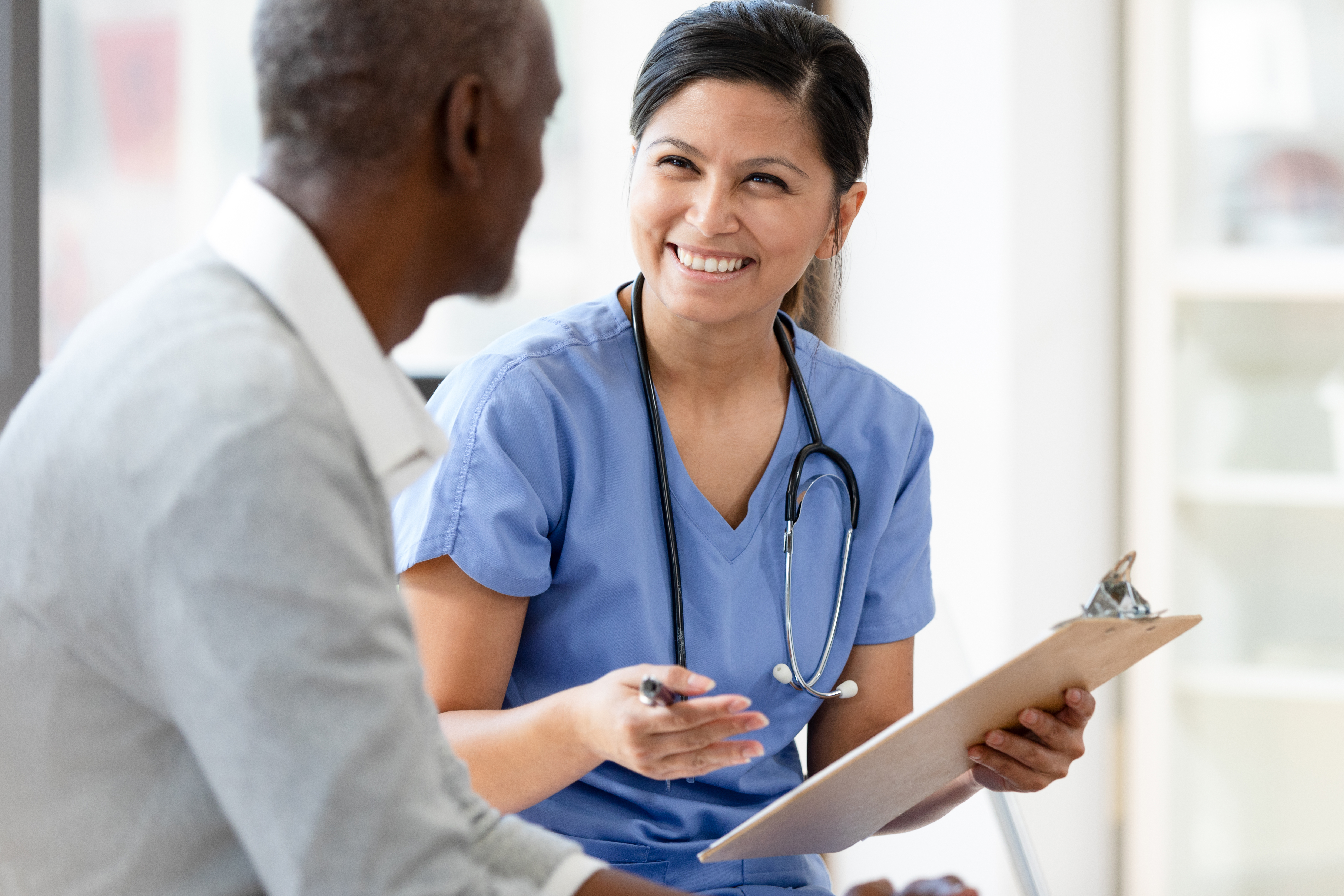 A health care provider talking to a patient
