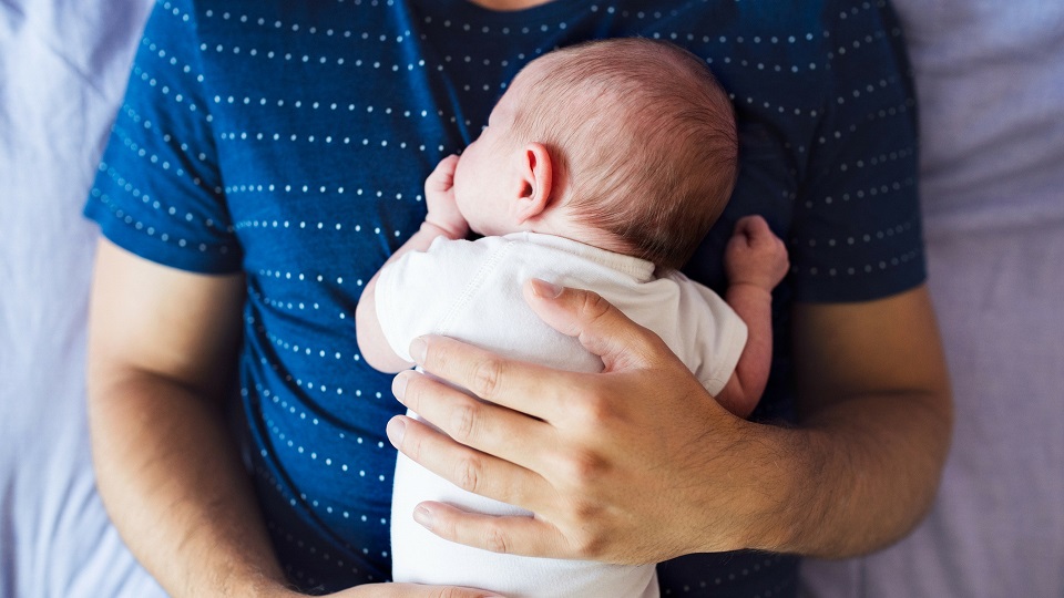 dad holding baby
