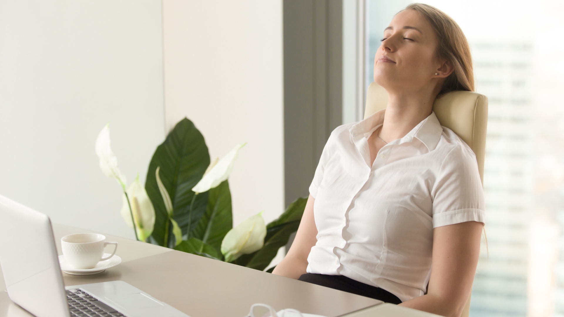 woman taking a breathing break at work