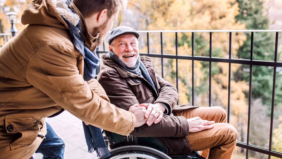 smiling man in wheelchair