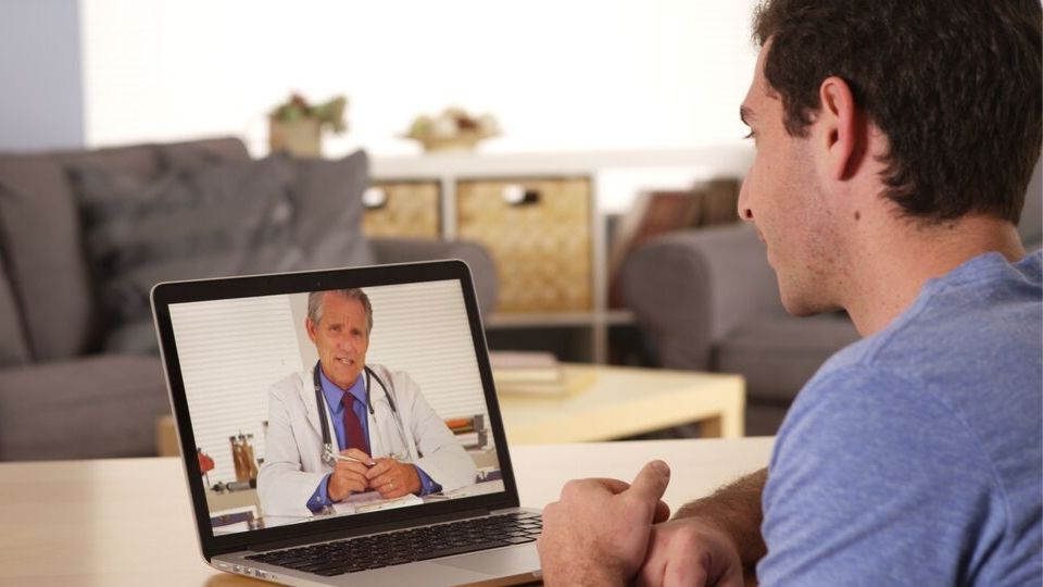 man doing virtual visit with a doctor