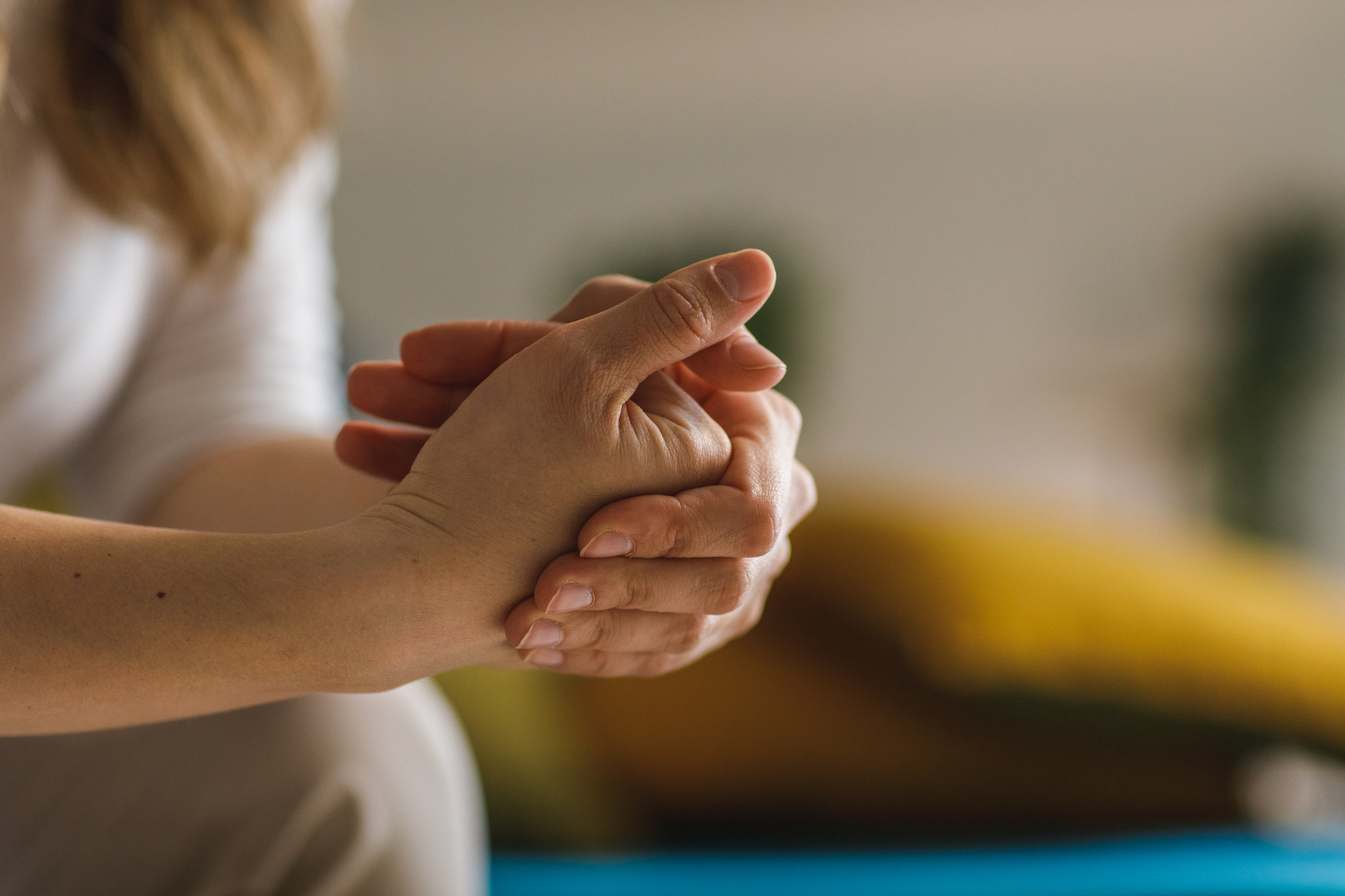 A photo of a woman cracking her knuckles