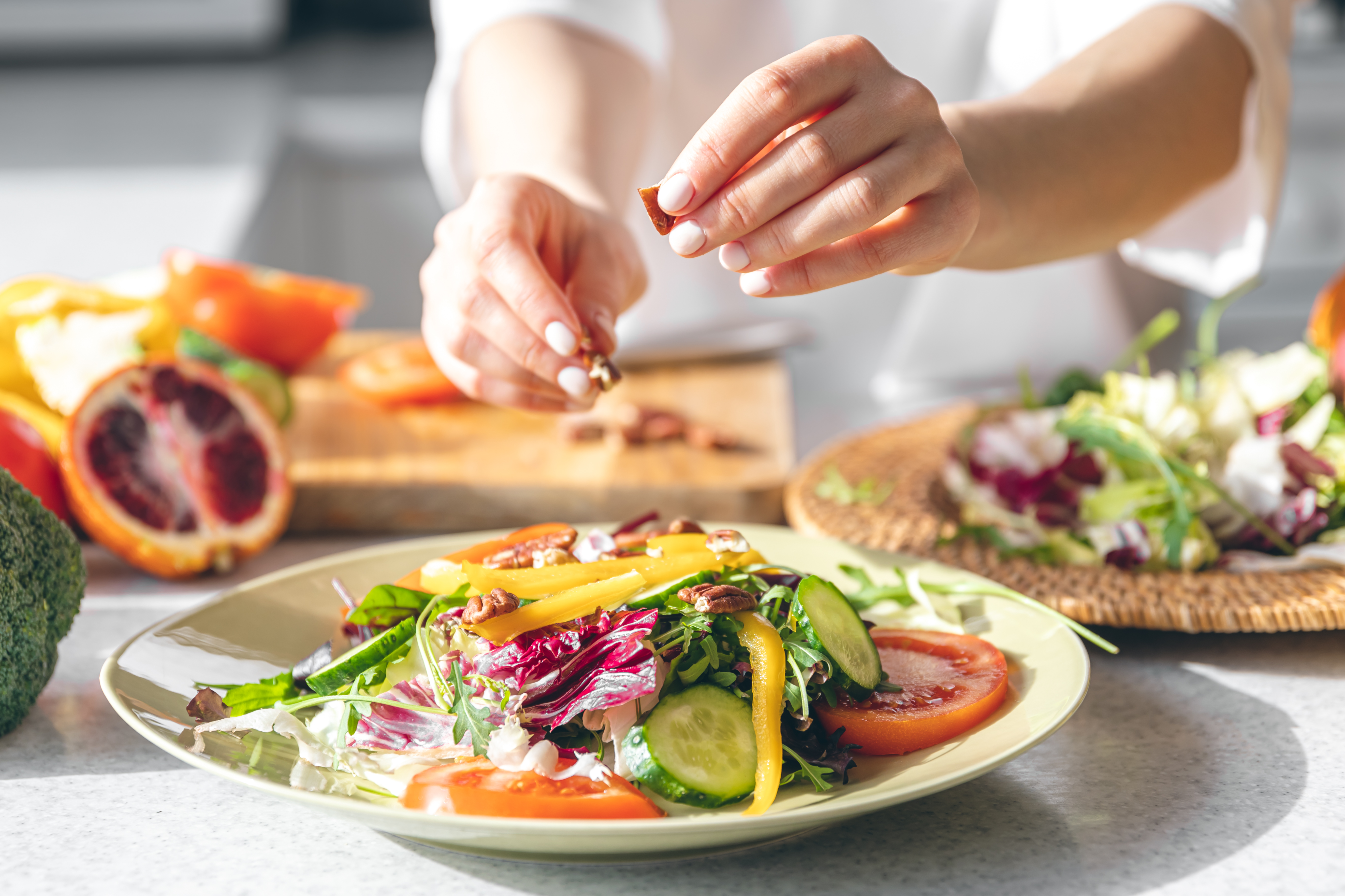 a person prepares a salad