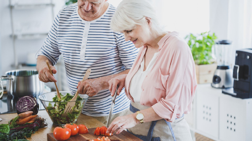 Couple making salad