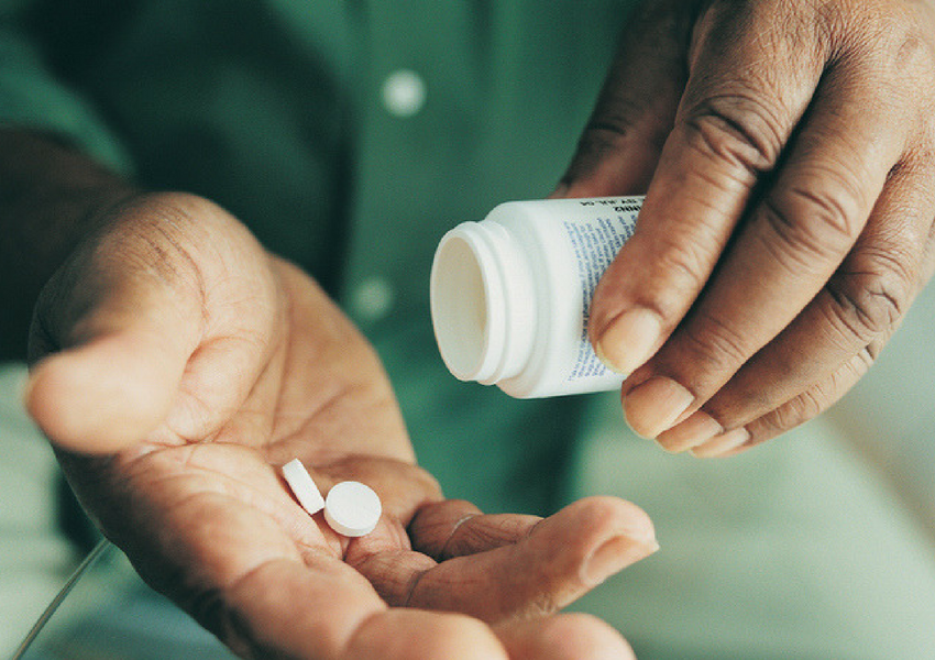 man taking medication