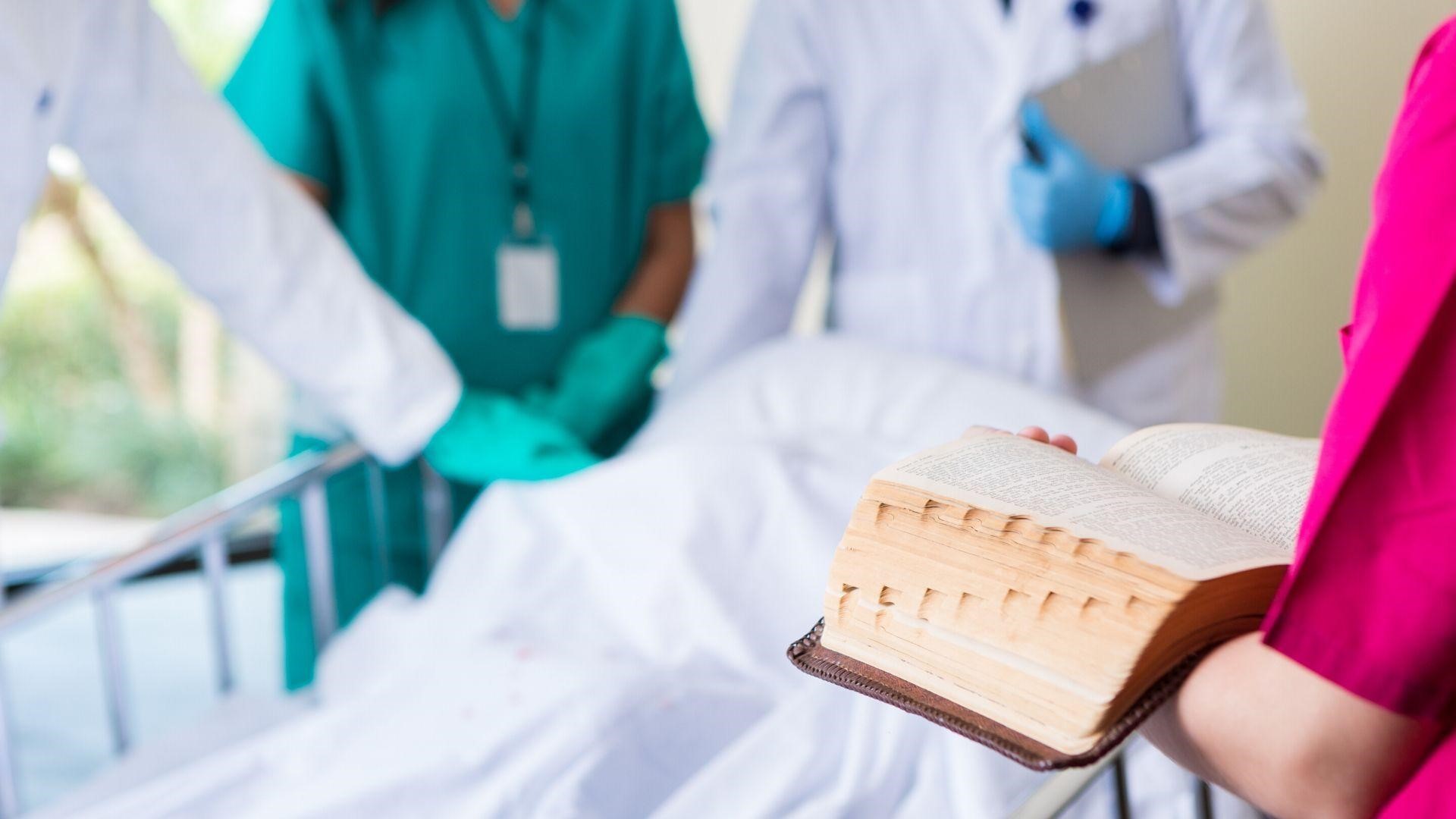 INTEGRIS chaplain by hospital bed