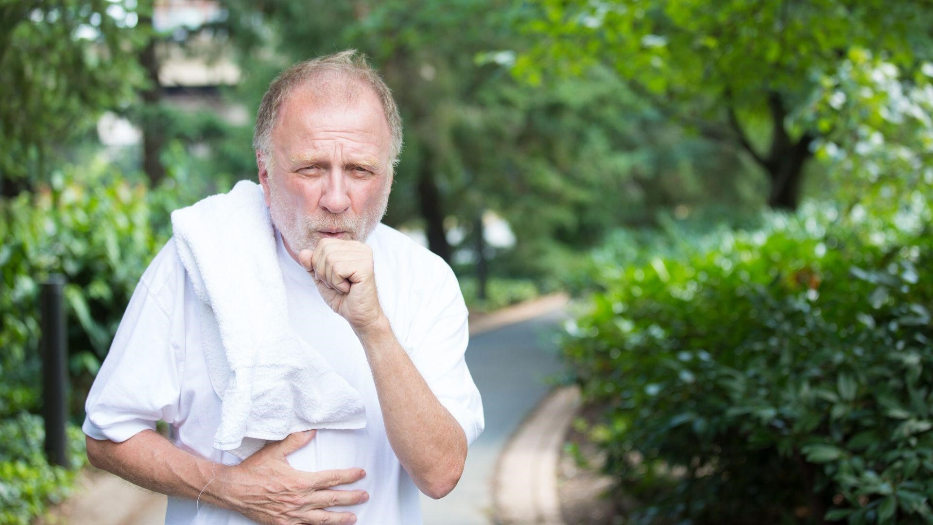 older man coughing