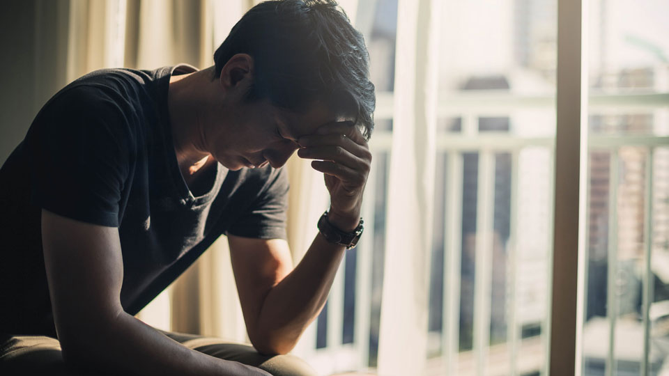 young man struggling with mental health
