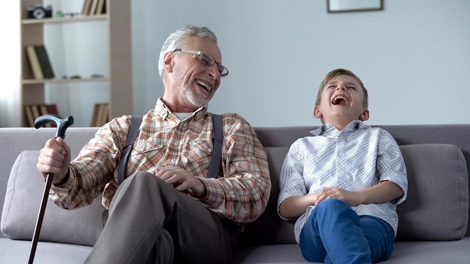 Man and child laughing