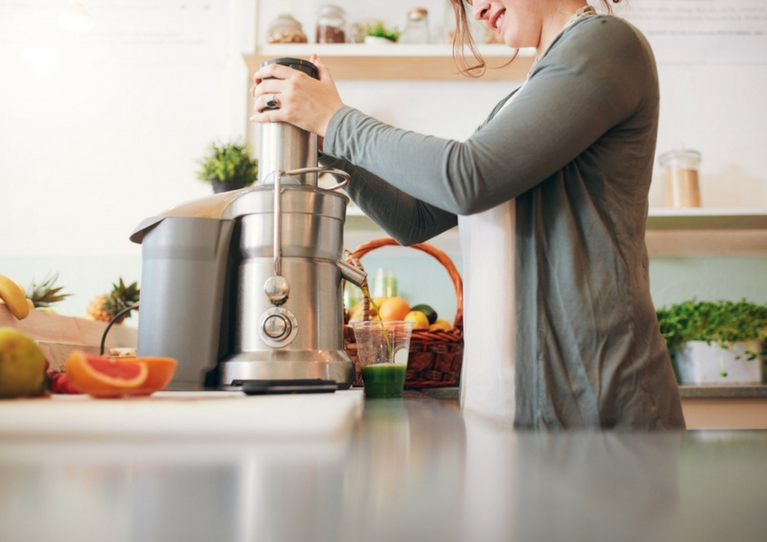 Woman Using Juicer