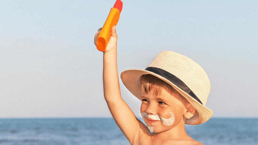 young boy with sunscreen