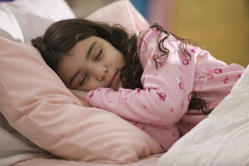 Girl sleeping in her bed