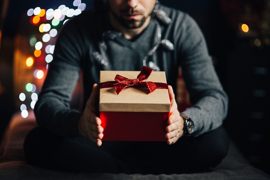 Man holding Christmas gift
