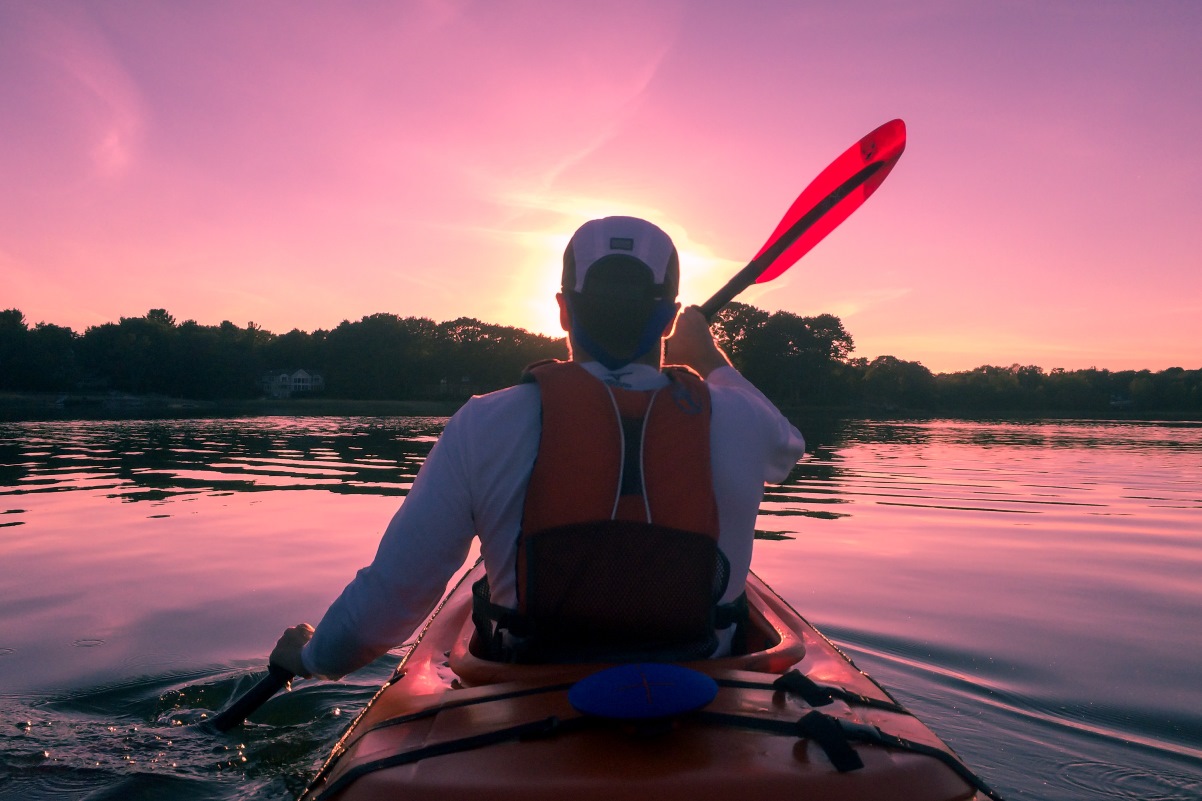 Man in a kayak on a lake